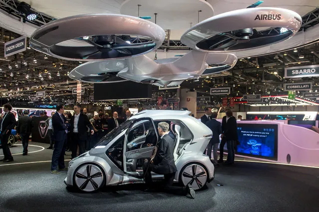 The “Pop.up next” concept flying car, a hybrid vehicle that blends a self-driving car and passenger drone by Audi, italdesign and Airbus is seen at the 88th Geneva International Motor Show on March 6, 2018 in Geneva, Switzerland. Global automakers are converging on the show as many seek to roll out viable, mass-production alternatives to the traditional combustion engine, especially in the form of electric cars. The Geneva auto show is also the premiere venue for luxury sports cars and imaginative prototypes. (Photo by Robert Hradil/Getty Images)