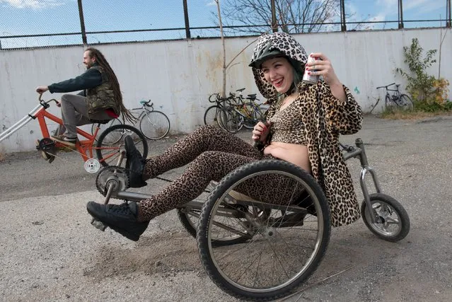 A woman rides a custom bike during "Bike Kill 12" in the Brooklyn borough of New York City, October 31, 2015. (Photo by Stephanie Keith/Reuters)