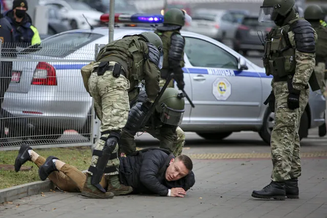 Police detain a demonstrator during an opposition rally to protest the official presidential election results in Minsk, Belarus, Sunday, November 1, 2020. (Photo by AP Photo/Stringer)
