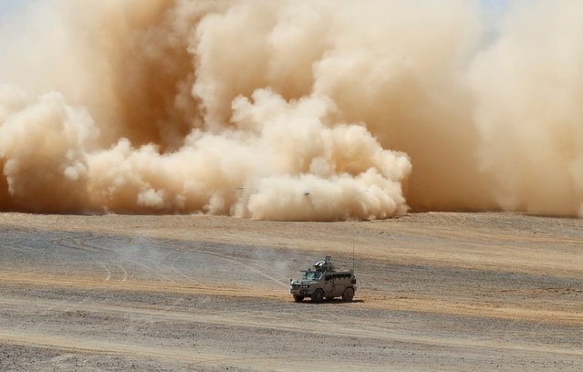A military vehicle drives during the “Eager Lion” joint military drills with the participation of the Jordanian Armed Forces, the U.S. and other partner countries, in Maan, Jordan on May 23, 2024. (Photo by Jehad Shelbak/Reuters)