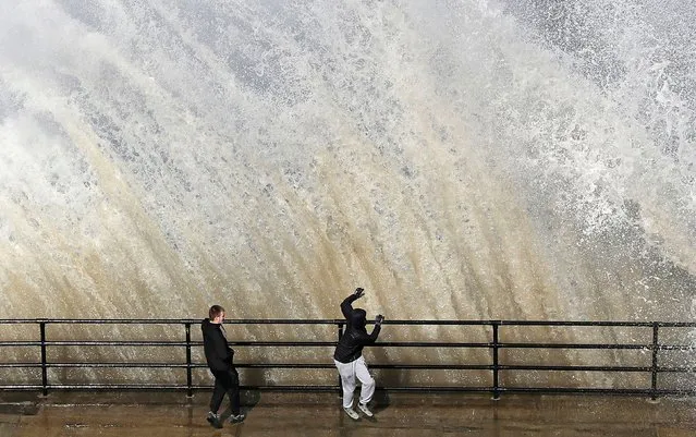 A giant wave crashes near Cullercoats on the northeast coast of Britain on March 29, 2018. (Photo by Owen Humphreys/PA Wire via AP Photo)