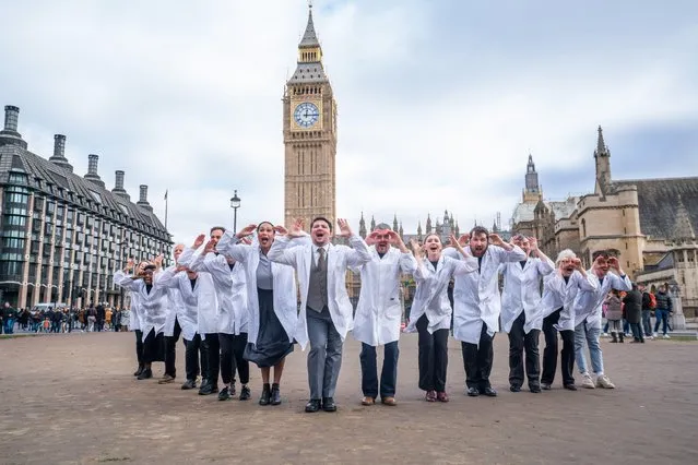 Actors playing doctors rehearse in Parliament Square in London on February 20, 2023 in the musical The Mold That changed the world about Alexander Fleming which tells the story of the discovery of penicillin. The Mold that Changed the World first appeared at the Edinburgh fringe in 2018. (Photo by Amer Ghazzal/Alamy Live News)