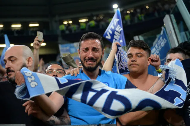 Napoli fans celebrate after winning the end of the Italian Serie A football match between Juventus and Napoli on April 22, 2018 at the Allianz Stadium in Turin, Italy. (Photo by Massimo Pinca/Reuters)