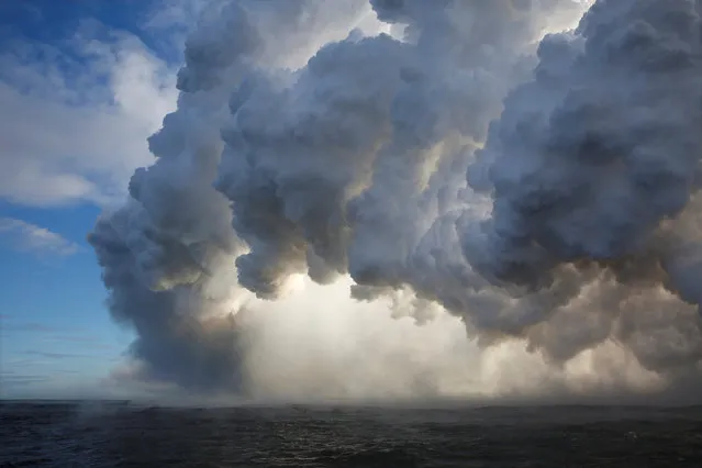 Lava flows into the Pacific Ocean in the Kapoho area, east of Pahoa, during ongoing eruptions of the Kilauea Volcano in Hawaii, U.S., June 4, 2018. (Photo by Terray Sylvester/Reuters)