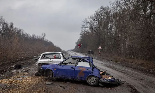 Cars marked with a “Z” used by Russian military are seen destroyed on a road on the outskirts of Trostyanets on March 30, 2022 in Trostyanets, Ukraine. Ukrainian forces announced this week that they had retaken Trostyanets, a northeastern town that has seen fierce fighting and was occupied by Russians for weeks, from Russian control. Last week, after its advances have stalled on several fronts, Russia appeared to revise its military goals in Ukraine, claiming that it would focus its efforts on the battle in the eastern Donbas region. (Photo by Chris McGrath/Getty Images)
