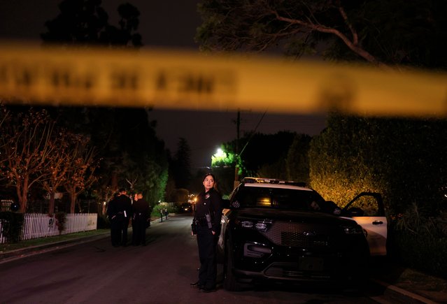 APD officers keep watch as the police investigate two people found dead in Rob Reiner's home on December 14, 2025 in Brentwood, California. The LAPD confirmed that the deceased are Rob Reiner and his wife Michele Singer Reiner. (Photo by Mario Tama/Getty Images)