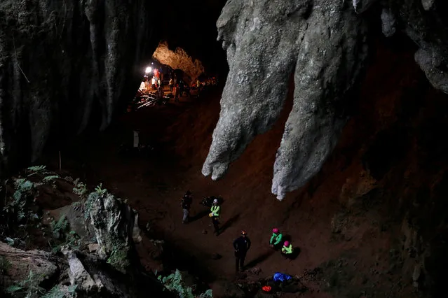 Rescue workers are seen in Tham Luang caves during a search for 12 members of an under-16 soccer team and their coach, in the northern province of Chiang Rai, Thailand, June 27, 2018. (Photo by Soe Zeya Tun/Reuters)