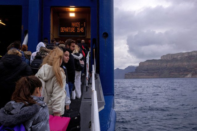 People board a ferry to Piraeus, during an increased seismic activity on the island of Santorini, Greece on February 4, 2025. Santorini took its current shape following one of the largest volcanic eruptions in history, around 1600 BC. The last eruption in the area occurred in 1950. (Photo by Alkis Konstantinidis/Reuters)