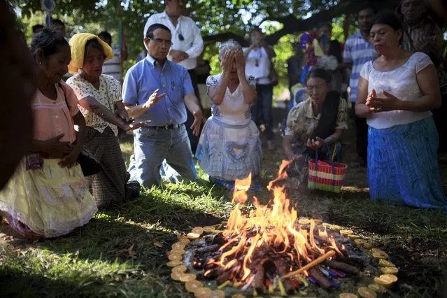 People participate in a traditional ceremony to celebrate as the title of mayor of the local indigenous community is granted official recognition in Izalco, El Salvador December 21, 2015. The Salvadoran Institute for Municipal Development (ISDEM) recognized the local indigenous government in Izalco as an ancentral authority, making it the first indigenous government in the country. (Photo by Jose Cabezas/Reuters)