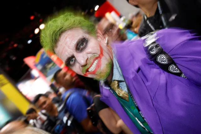 An attendee dressed as the Joker from the Batman series arrives during opening day of pop culture convention Comic Con International in San Diego, USA on Thursday, July 19, 2018. (Photo by Mike Blake/Reuters)