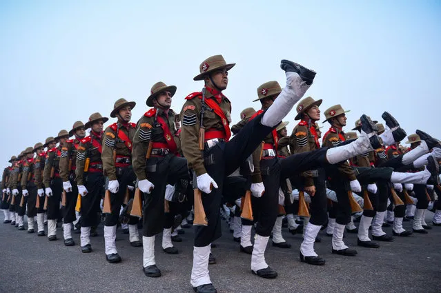 Indian soldiers of the Assam Rifles march during a rehearsal for the forthcoming Republic Day parade on a foggy winter morning at Rajpath in New Delhi on January 4, 2016. India will celebrate its 67th Republic Day on January 26 with a large military parade. (Photo by Chandan Khanna/AFP Photo)