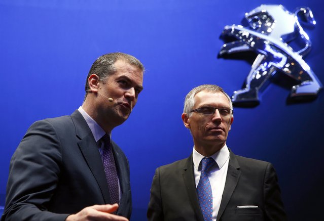 Maxime Picat, Peugeot Brand CEO and Carlos Tavares, CEO of PSA Peugeot Citroen (R) address media during the first press day ahead of the 85th International Motor Show in Geneva March 3, 2015. REUTERS/Arnd Wiegmann   