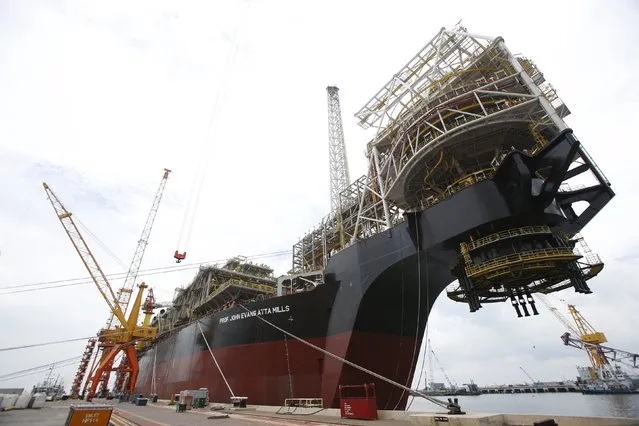 A view of Tullow Oil's Floating Production, Storage and Offloading vessel (FPSO) Prof. John Evans Atta Mills which was completed at Sembcorp Marine's Jurong Shipyard in Singapore January 20, 2016. Amid one of the deepest oil price crashes in history, Britain's Tullow Oil is sending one of the world's biggest floating deep-water oil production platforms to West Africa to pump crude for at least 20 years. (Photo by Edgar Su/Reuters)