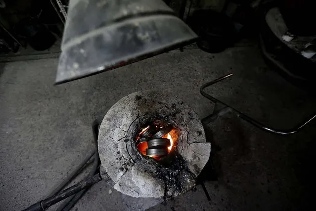 Steel melts in a oven before being poured in a form. (Photo by Stefan Wermuth/Reuters)