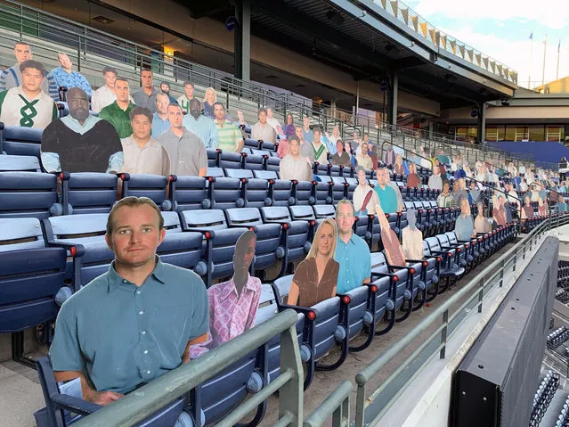 In this photo taken October 18, 2018, cardboard cutouts are installed at Georgia State Stadium in Atlanta for an episode of “Brockmire”. Even though it was converted to college football after the Atlanta Braves left for the suburbs the stadium worked just fine as the stand-in for a fictional Florida spring training site in Hank Azaria's IFC show “Brockmire”, in which he portrays a tart-tongued baseball announcer trying to recapture his former glory after a failed marriage, a very public meltdown and struggles with addiction. (Photo by Paul Newberry/AP Photo)