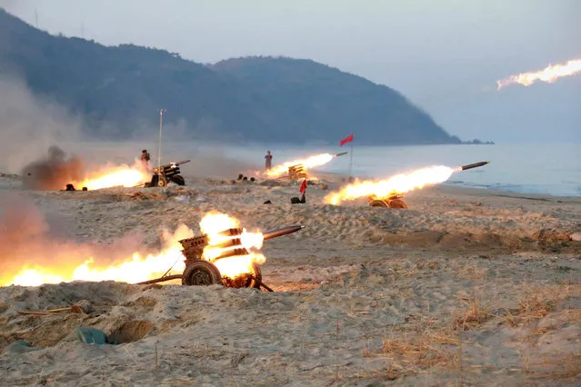 A view of a firing contest among multiple launch rocket system (MLRS) batteries selected from large combined units of the KPA, in this undated photo released by North Korea's Korean Central News Agency (KCNA) in Pyongyang on December 21, 2016. (Photo by Reuters/KCNA)