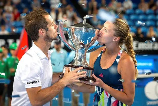 France's Kristina Mladenovic and Richard Gasquet kiss the trophy after defeating the Unites States in the final of the Hopman Cup in Perth, Australia, January 7, 2017. (Photo by Tony McDonough/Reuters/AAP)