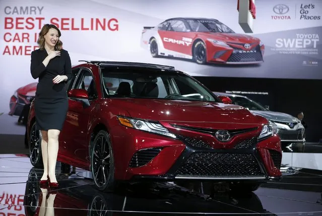 Model Kelly Paredes poses with the 2018 Toyota Camry during the North American International Auto Show in Detroit, Michigan, U.S., January 10, 2017. (Photo by Rebecca Cook/Reuters)