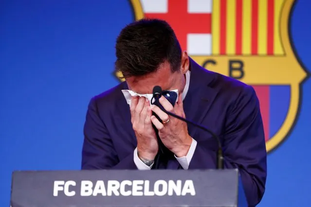 Lionel Messi cries at the start of a press conference at the Camp Nou stadium in Barcelona, Spain, Sunday, August 8, 2021. FC Barcelona had previously announced the negotiations with Lionel Messi had ended and that Messi would be leaving the club. (Photo by Joan Monfort/AP Photo)