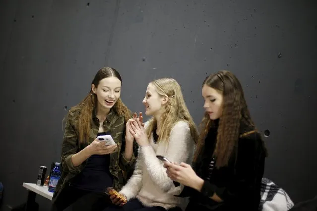 Models use their phones backstage of the Aquilano Rimondi Autumn/Winter 2016 woman collection during Milan Fashion Week, Italy, February 27, 2016. (Photo by Alessandro Garofalo/Reuters)