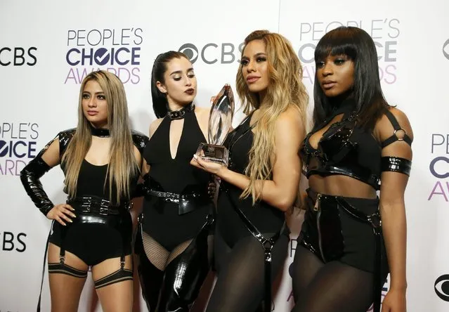 Members of Fifth Harmony pose with their award for Favorite Band backstage at the People's Choice Awards 2017 in Los Angeles, California, U.S., January 18, 2017. (Photo by Danny Moloshok/Reuters)