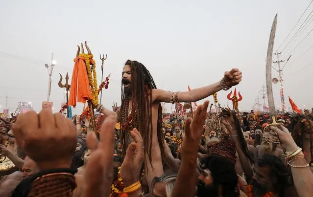 Naga Sadhus or Hindu holy men arrive to take a holy dip during the second “Shahi Snan” (grand bath) at the “Kumbh Mela” or the Pitcher Festival, in Prayagraj, previously known as Allahabad, India, February 4, 2019. (Photo by Anushree Fadnavis/Reuters)