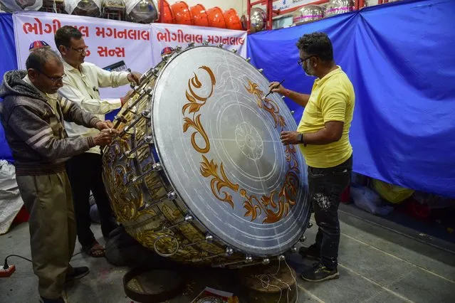 Artisans from Dabgar community works on a huge “Nagara” (Drum) for a temple to Hindu deity Ram in Ayodhya, in Ahmedabad on January 4, 2024. (Photo by Sam Panthaky/AFP Photo)