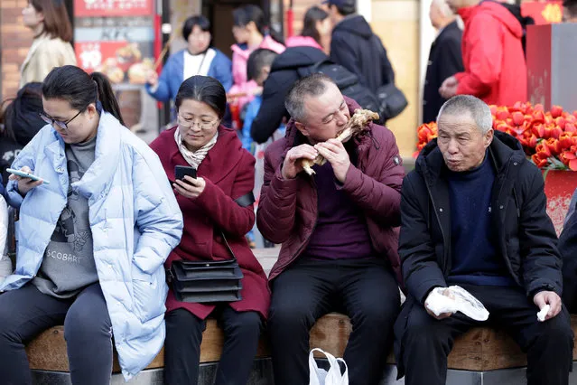 Tourists are seen at Wangfujing street in central Beijing, China on February 28, 2019. (Photo by Jason Lee/Reuters)