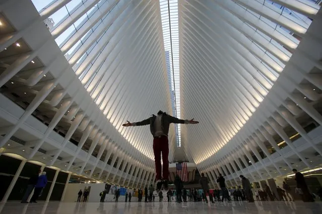 Kevin Arner from Brooklyn, jumps in the air as he films a video of himself at the World Trade Center Oculus transportation hub in the Manhattan borough of New York, March 3, 2016. (Photo by Carlo Allegri/Reuters)