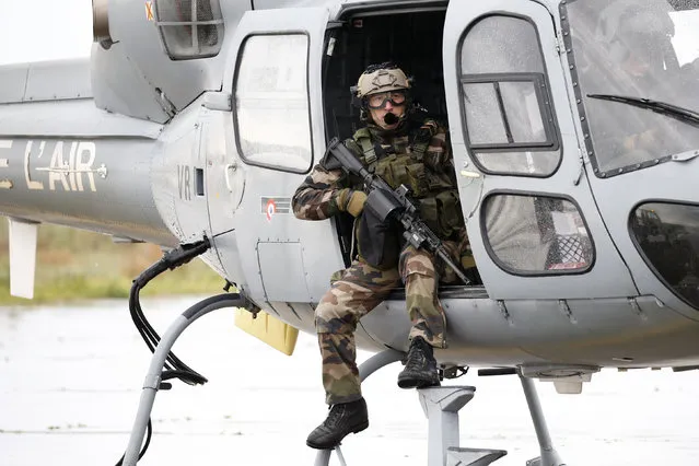 A French Air Force snipper in a Fennec helicopter takes off during the close air support (CAS) exercise Serpentex 2016 hosted by France in the Mediterranean island of Corsica, at Solenzara air base, March 17, 2016. (Photo by Charles Platiau/Reuters)
