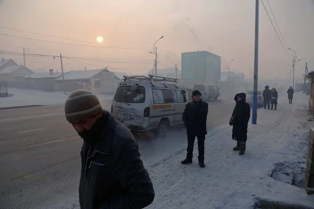 People commute in an industrial area on a cold day in Ulaanbaatar, Mongolia, January 19, 2017. (Photo by B. Rentsendorj/Reuters)