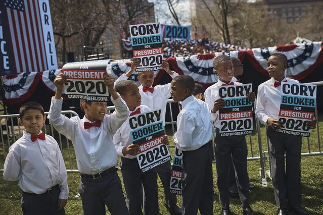 Children show support during a hometown kickoff for Cory Booker's national presidential campaign tour at Military Park in downtown Newark, N.J., Saturday, April 13, 2019. (Photo by Andres Kudacki/AP Photo)