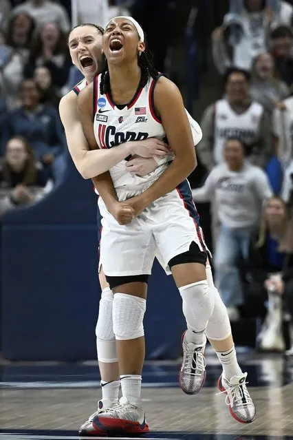 UConn guard Paige Bueckers, left, celebrates with teammate KK Arnold in the second half of a second-round college basketball game in the NCAA Tournament against Syracuse, Monday, March 25, 2024, in Storrs, Conn. (Photo by Jessica Hill/AP Photo)