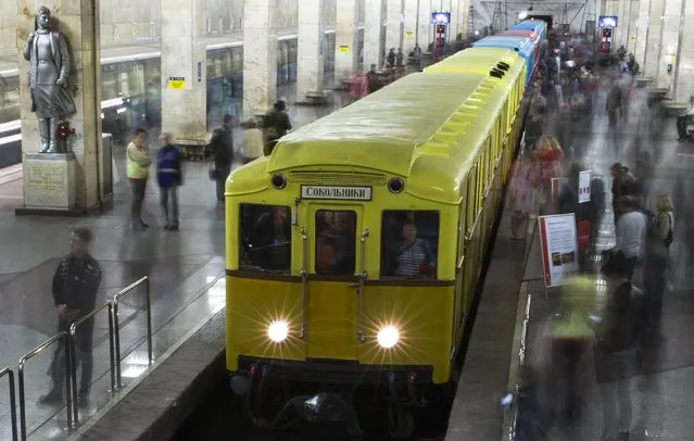 People come to have a look at Soviet-era vintage subway cars parked in the Partizanskaya subway station in Moscow, Russia, Friday, May 15, 2015. (Photo by Pavel Golovkin/AP Photo)