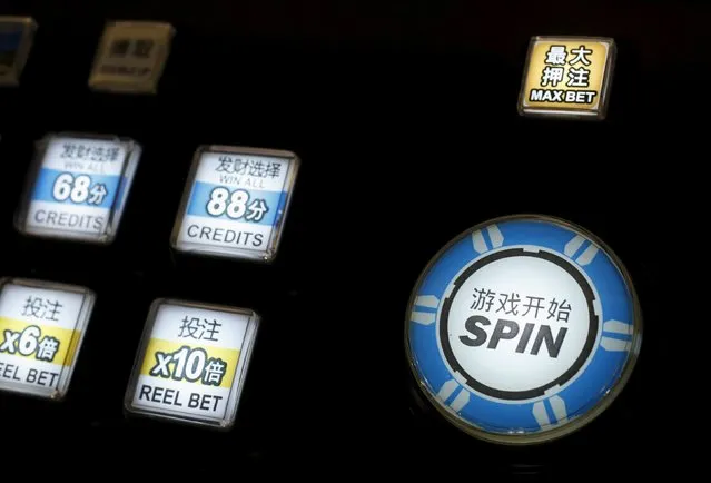 Buttons of a slot machine are lit at the Global Gaming Expo (G2E) Asia in Macau, China May 19, 2015. (Photo by Bobby Yip/Reuters)