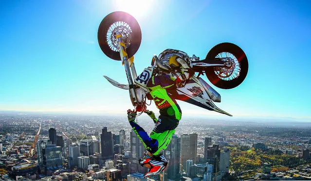 World Champion Trials bike rider Jack Field of Australia poses after performing the highest backflip on a motorcycle ever recorded as he flips his motorbike upside down on the roof of Melbourne's Eureka Tower (297.3 metres) during a AUS-X Open media opportunity at Eureka Tower on May 22, 2019 in Melbourne, Australia. The largest international Supercross and action sports event in the world outside of the USA, the AUS-X Open will be held at Melbourne's Marvel Stadium on November 30 2019. (Photo by Scott Barbour/Getty Images)