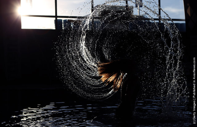 Swimmer Michelle McKeehan of the United States whirls her hair in the bathing pool before the start of the evening session during Day Four of the XVI Pan American Games