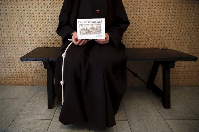 Sister Isabel, 39, a cloistered St. Clare nun, poses with a box of sweets “Caprichos de Dulcinea” (Dulcinea cravings) made at her convent in the hometown of Don Quixote's ladyship Dulcinea, in El Toboso, Spain, April 6, 2016. (Photo by Susana Vera/Reuters)