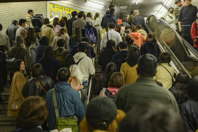 Kudashita Station, Tokyo, on April 6 2024. Tourists clog a subway exit at one of the more popular viewing spots. (Photo by Irwin Wong for The Washington Post)