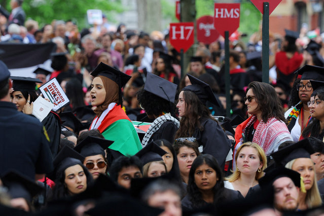 Graduating students walk out of the he 373rd Commencement Exercises at Harvard University in support of 13 students not able to graduate because of their participation in pro-Palestinian protests, amid the ongoing conflict between Israel and the Palestinian Islamist group Hamas, in Cambridge, Massachusetts, U.S., May 23, 2024. (Photo by Brian Snyder/Reuters)