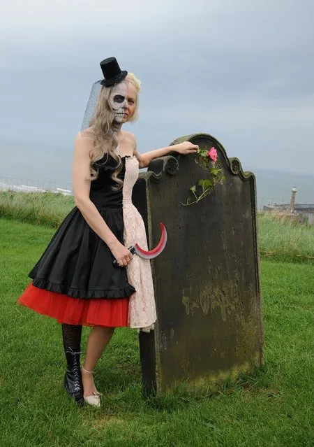 Lesley Scaife stands in the grounds of St Mary's Church, Whitby, during the Whitby Gothic festival taking place this weekend, on  April 27, 2014. The twice yearly event attracts Goths from across the UK and beyond to the historic fishing town and is a great boost to the local economy. (Photo by Anna Gowthorpe/PA Wire)