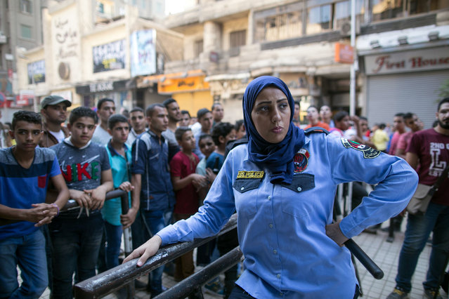 An Egyptian policewoman from a newly formed anti-harassment force is deployed in Cairo on the first day of Eid Al-Fitr, Friday, July 17, 2015. (Photo by Roger Anis/AP Photo)