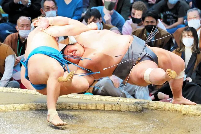 Komusubi Hoshoryu throws ozeki Takakeisho (R) to win on day three of the Grand Sumo Spring Tournament at Edion Arena Osaka on March 15, 2022 in Osaka, Japan. (Photo by The Asahi Shimbun via Getty Images)