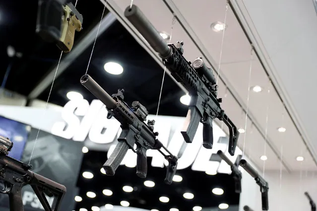 Guns are seen on display in the trade booths during the National Rifle Association's annual meeting in Louisville, Kentucky, May 21, 2016. (Photo by Aaron P. Bernstein/Reuters)