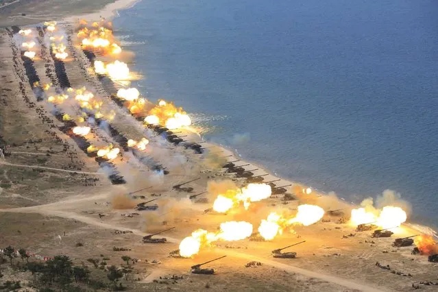 An undated photograph released by the Korean Central News Agency (KCNA) on 26 April 2017 shows the combined fire demonstration of the services of the Korean People's Army in celebration of its 85th founding anniversary, at an undisclosed location in North Korea. According to reports, Pyongyang on 25 April deployed aircraft and submarines as parts of artillery drills simulating an attack on “enemy warships”, observed by North Korean leader Kim Jong-un to celebrate the 85th anniversary of the Korean People's Army. (Photo by EPA/KCNA)