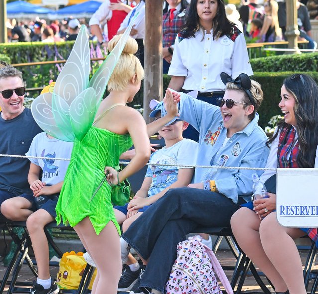 American actress Ginnifer Goodwin looks like she's having a blast as she enjoys a parade at Disneyland on August 10, 2024. Ginnfer who was joined by her two kids and husband Josh Dallas enjoyed a day at the happiest place on earth, which included a high five from Tinkerbell. Ginnifer was seen enjoying many of the park's rides with her family including the matterhorn, big thunder mountain and the pinnochio ride in Fantasyland. (Photo by Snorlax/The Mega Agency)