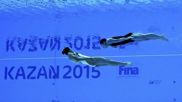 Atsushi Abe and Yumo Adachi of Japan are seen underwater as they perform in the synchronised swimming mixed duet free routine preliminary at the Aquatics World Championships in Kazan, Russia July 28, 2015. (Photo by Michael Dalder/Reuters)