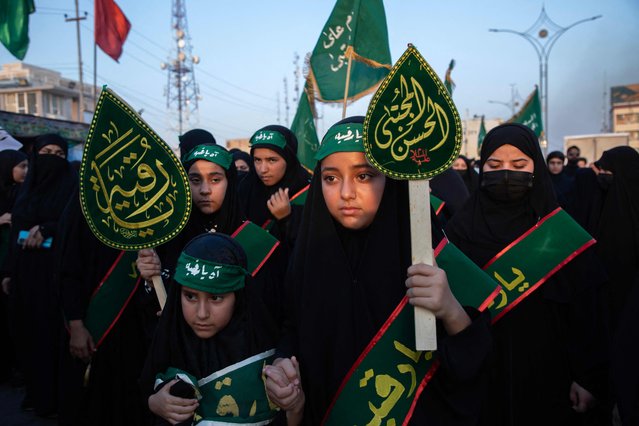 Iraqis Muslim women honour Ruqayyah, the daughter of the Prophet Mohamed's grandson Imam Hussein, as they march from Nasiriyah in Iraq's southern Dhi Qar province toward the holy city of Karbala toward the holy city of Karbala to partake in the upcoming Arbaeen religious festival on August 12, 2024. (Photo by Asaad Niazi/AFP Photo)