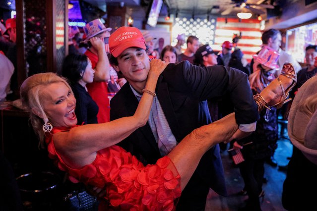 Supporters of Donald Trump dance as they react to election results while attending the New York Young Republican Club watch party during the 2024 U.S. presidential election, in Manhattan, New York City on November 6, 2024. (Photo by Andrew Kelly/Reuters)