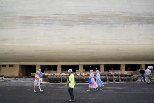 Patrons and construction workers walk outside the Ark Encounter July 5, 2016 in Williamstown, Kentucky. (Photo by Aaron P. Bernstein/Getty Images)